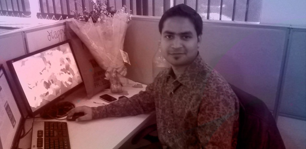 Dhruv Chauhan at work with a colleague