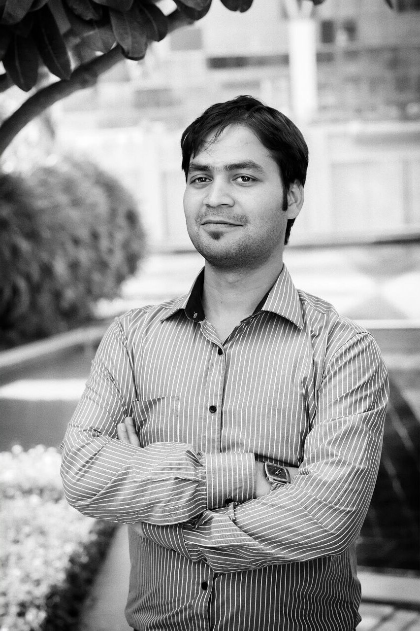 Dhruv Chauhan standing in infosys garden and smiling